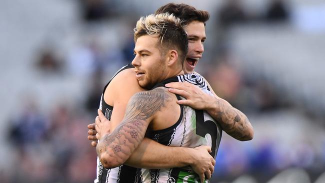 Jamie Elliot and Jack Crisp celebrate a goal.