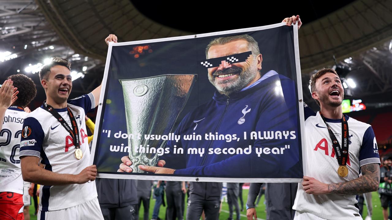 Sergio Reguilon (left) and James Maddison hold up a banner with Postecoglou’s famous line. (Photo by Alex Pantling – UEFA/UEFA via Getty Images)