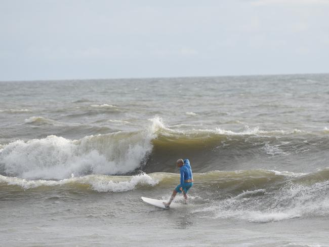 Surfers have been making the most of the swell at Neilson Park Beach, Bargara