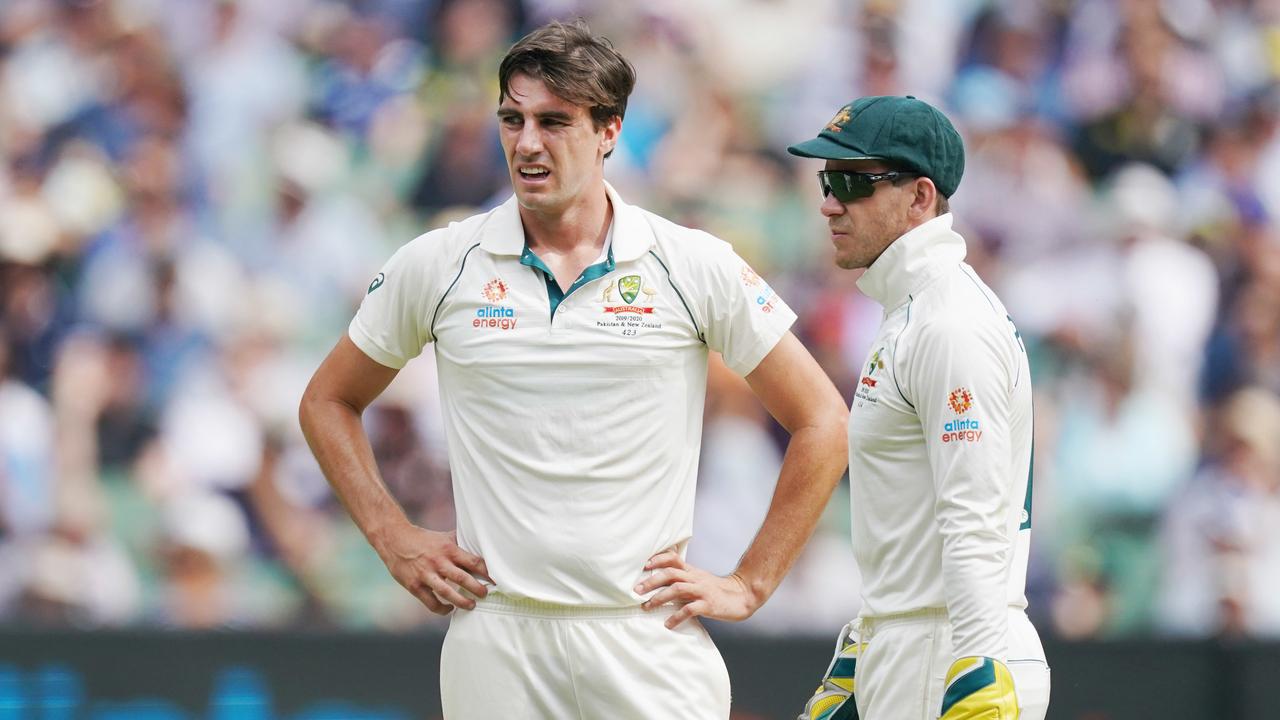 Pat Cummins of Australia (left) and Tim Paine decide not to challenge an appeal turned down on day 3 of the Boxing Day Test match between Australia and New Zealand at the MCG in Melbourne, Saturday, December 28, 2019. (AAP Image/Michael Dodge) NO ARCHIVING, EDITORIAL USE ONLY, IMAGES TO BE USED FOR NEWS REPORTING PURPOSES ONLY, NO COMMERCIAL USE WHATSOEVER, NO USE IN BOOKS WITHOUT PRIOR WRITTEN CONSENT FROM AAP