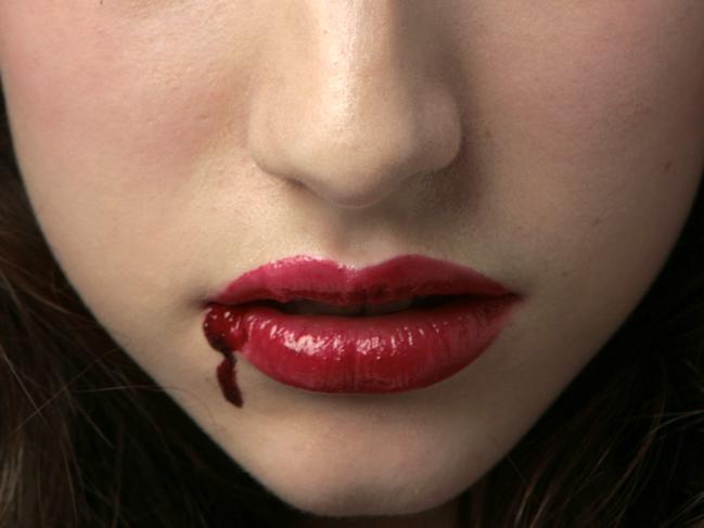 Finesse model Joanna as vampire with blood on lip.