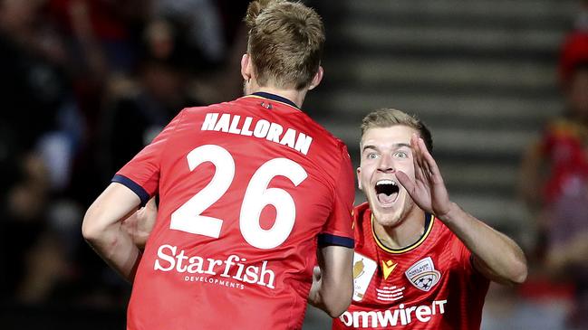 Riley McGree celebrates with Ben Halloran after he scored United's second goal. Picture SARAH REED