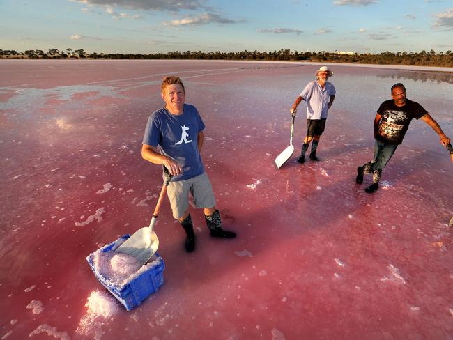 Richard Seymour with his father Neil Seymour and Adrian Morgan harvesting pink salt from Pink Lake in Dimboola Victoria. Picture: David Geraghty