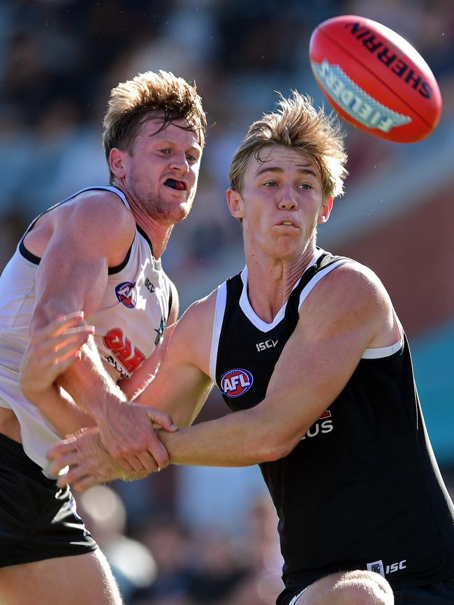 Todd Marshall, right, beats Tom Jonas to the ball at Port Adelaide's first intra-club at Alberton. Picture: Tom Huntley