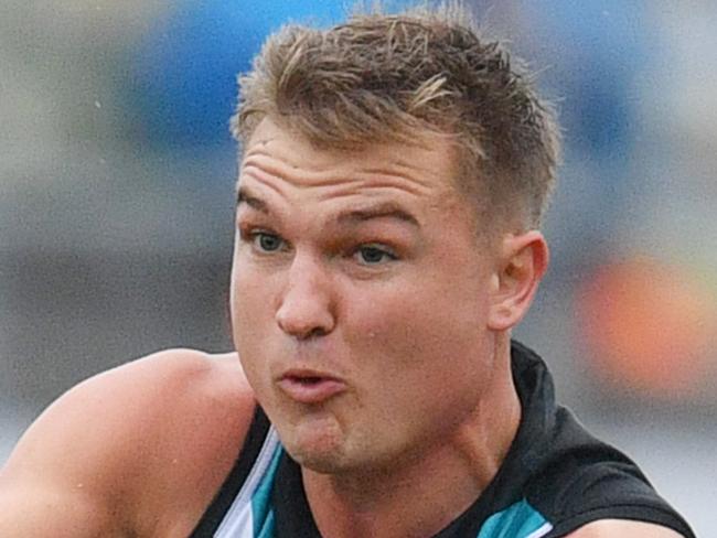 Ollie Wines of the Power is tackled by Lachie Weller of the Suns during the Round 9 AFL match between the Gold Coast Suns and the Port Adelaide Power at the Adelaide Arena at Jiangwan Stadium in Shanghai, China, Saturday, May 19, 2018. (AAP Image/David Mariuz) NO ARCHIVING, EDITORIAL USE ONLY