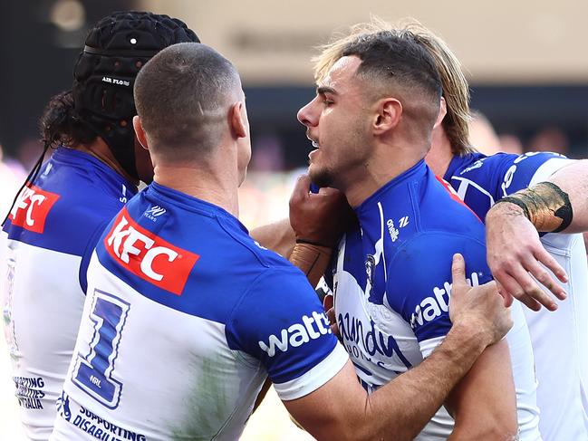 BRISBANE, AUSTRALIA - MAY 04: Jacob Kiraz of the Bulldogs celebrates with team mates after scoring a try during the round nine NRL match between the Gold Coast Titans and Canterbury Bulldogs at Suncorp Stadium on May 04, 2025, in Brisbane, Australia. (Photo by Chris Hyde/Getty Images)