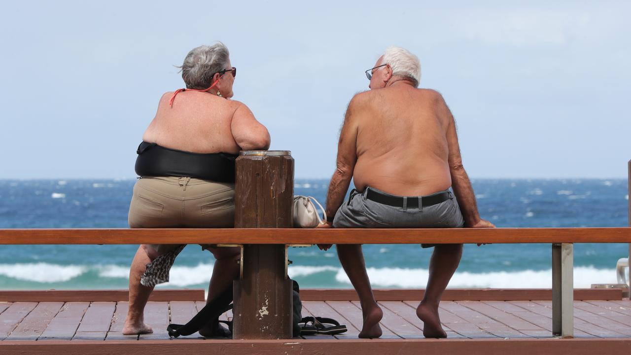 Faces of the Gold Coast, at Broadbeach. Diane and Cosimo Colucci from England stuck in the Aussie sun as they can’t go home. Picture Glenn Hampson