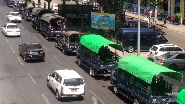 Army trucks line the road in Yangon on Monday. Picture: AFP