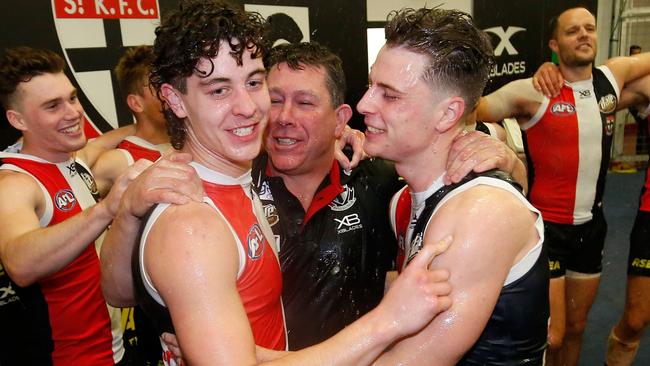 Brett Ratten celebrates his first win as coach with Nick Coffield and Doulton Langlands. Picture: Darrian Traynor/AFL Photos/Getty Images.