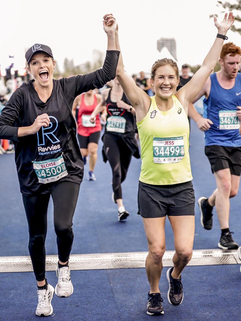 Elouise Wellings and Jessica Stenson are delighted to cross the finish line of the Southern Cross University ten kilometre Run. Picture: Tim Marsden.