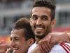 Mohamed (L) and scorer Ali Ahmed Mabkhout (R) of UAE react after a goal during the Asian Cup football match between UAE and Qatar in Canberra on January 11, 2015. AFP PHOTO / MARK GRAHAM --- IMAGE RESTRICTED TO EDITORIAL USE - STRICTLY NO COMMERICAL USE --