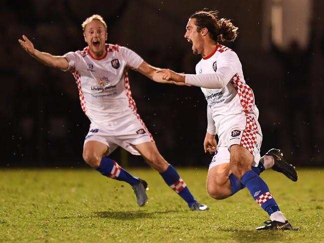 Defender Oskar Dillon (right) celebrates his goal during the NPL grand final against Olympic on Sunday night. Picture: Albert Perez/Getty Images