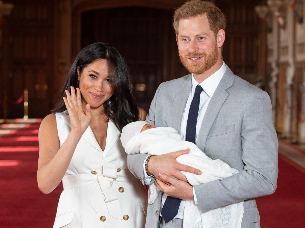 Meghan Markle kept her outfit chic and minimalist, with a white dress and simple accessories. Picture: Dominic Lipinski