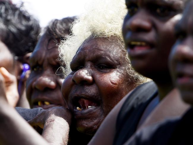 Muluwurri Magpies fans cheer on their team against Tuyu Buffaloes in the Tiwi Islands Football League grand final on Bathurst Island. PICTURE: Elise Derwin