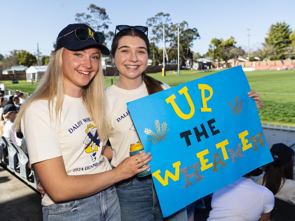 Chloe Capes (left) and Clare Adcock get behind the Wheatmen Downs Rugby grand final day at Clive Berghofer Stadium, Saturday, August 24, 2024. Picture: Kevin Farmer