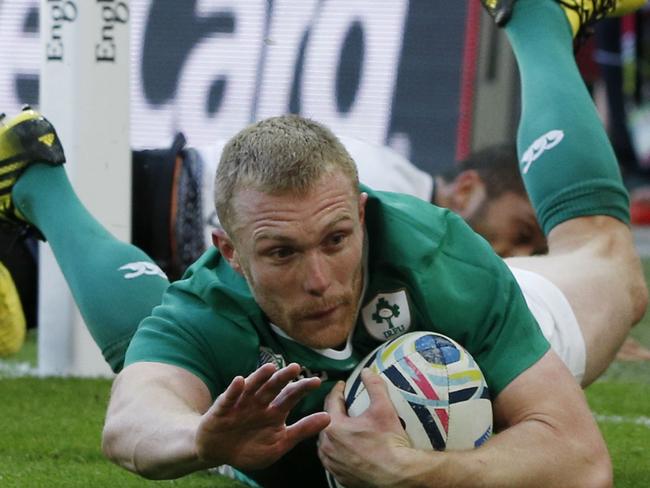 Ireland's wing Keith Earls scores their second try during a Pool D match of the 2015 Rugby World Cup between Ireland and Romania at Wembley stadium, north London, on September 27, 2015. AFP PHOTO / ADRIAN DENNIS RESTRICTED TO EDITORIAL USE, NO USE IN LIVE MATCH TRACKING SERVICES, TO BE USED AS NON-SEQUENTIAL STILLS