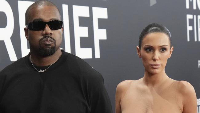 EDS NOTE: NUDITY - Kanye West, left, and Bianca Censori arrive at the 67th annual Grammy Awards on Sunday, Feb. 2, 2025, in Los Angeles. (Photo by Jordan Strauss/Invision/AP)