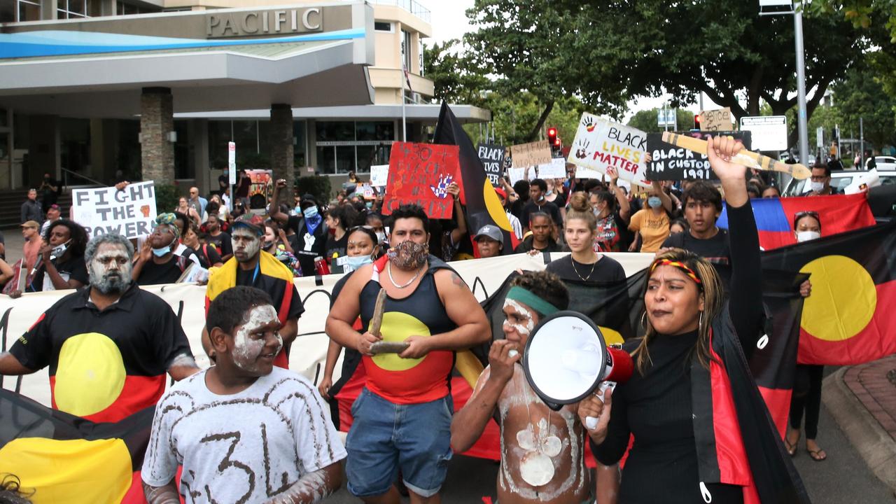 Thousands march through the Cairns CBD chanting and waving placards to protest black deaths in custody and support the Black Lives Matter movement. Picture: PETER CARRUTHERS