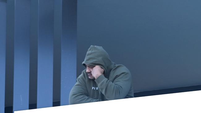 A resident looks out of a balcony of the apartment complex in Sydney's Campbelltown. Picture: NCA NewsWire/Jeremy Piper