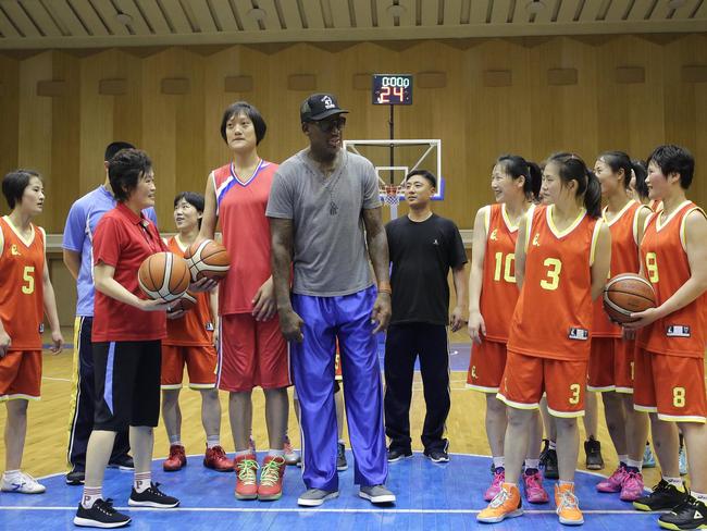 Dennis Rodman hangs out with North Korea's Pothonggang women’s basketball team. Picture: AP Photo/Kim Kwang Hyon