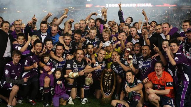 Storm players celebrate victory after the 2009 grand final.