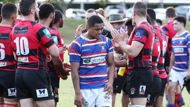 Bulls’ Felix Pese leads his players through a guard of honour formed by Mariners players at the end of Saturday’s grand final rematch. PICTURE: BRENDAN RADKE