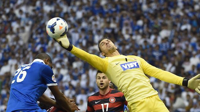 Western Sydney Wanderers goalkeeper Ante Covic (C) saves the ball during in the second leg of the 2014 AFC Champions League football final against Saudi Arabia's Al Hilal at King Fahad stadium in Riyadh, on November 1, 2014. AFP PHOTO/ FAYEZ NURELDINE