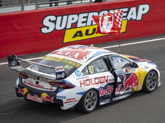 WARNING MUST CREDIT - Pictured is Shane van Gisbergen from Redbull Holden Racing Team, celebrating with a Holden flag up pit straight after winning the Supercheap Auto Bathurst 1000 at Mount Panorama Raceway today. Picture: Scott Wensley.