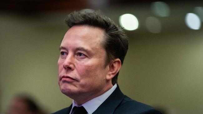 Elon Musk listens as US President-elect Donald Trump speaks during a meeting with House Republicans in Washington, DC. Picture: AFP