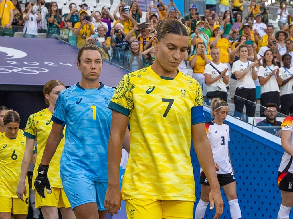 Steph Catley leading the team out for the second half of the Matildas’ loss to Germany.