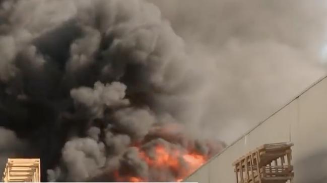 About 26 fire trucks and 100 firefighters were called to the huge blaze which destroyed six businesses in Sydney’s west. Picture: Supplied / Channel 9