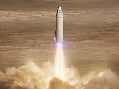 This artist's rendering made available by Elon Musk on Friday, Sept. 29, 2017 shows SpaceX's new mega-rocket design on Mars. With the 350-foot-tall spacecraft, Musk announced that his private space company aims to launch two cargo missions to the red planet in 2022. (SpaceX via AP)