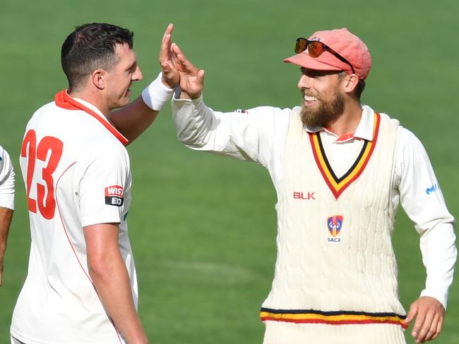 Daniel Worrall and Jake Lehmann of the Redbacks celebrate the dismissal of Wil Parker from the Bushrangers during day 1 of the Marsh Sheffield Shield cricket match between the South Australia Redbacks and the Victoria Bushrangers at Adelaide Oval in Adelaide, Friday, March 6, 2020. (AAP Image/David Mariuz) NO ARCHIVING, EDITORIAL USE ONLY, IMAGES TO BE USED FOR NEWS REPORTING PURPOSES ONLY, NO COMMERCIAL USE WHATSOEVER, NO USE IN BOOKS WITHOUT PRIOR WRITTEN CONSENT FROM AAP