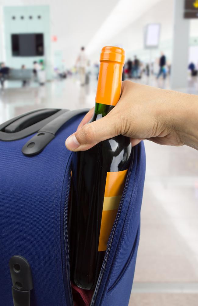 packing liquor bottles in suitcase