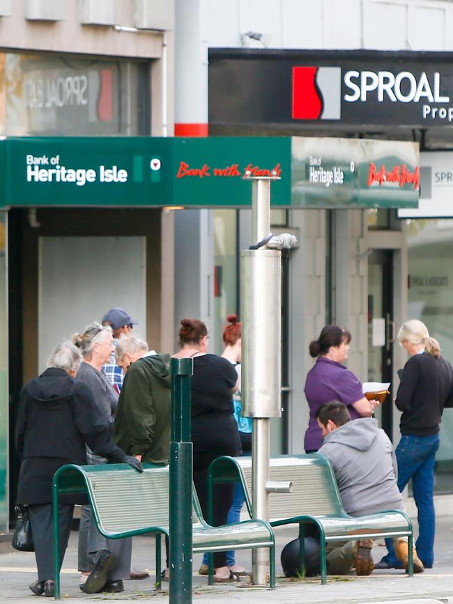 Bank of Heritage Isle customers wait outside the Launceston Branch after branch closures were announced. Picture: PATRICK GEE