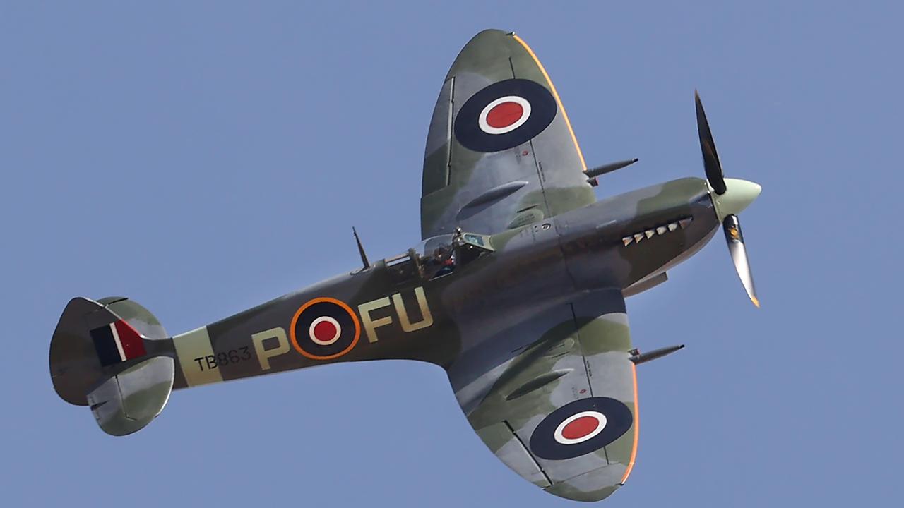 A WWII-era spitfire flying hight over the Australian International Airshow. Picture: David Caird