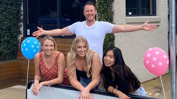 Fahrenheit Cafe owner Logan Dart and some of his staff celebrate a win with Central Coast Council for a drive through coffee bay. Picture: supplied