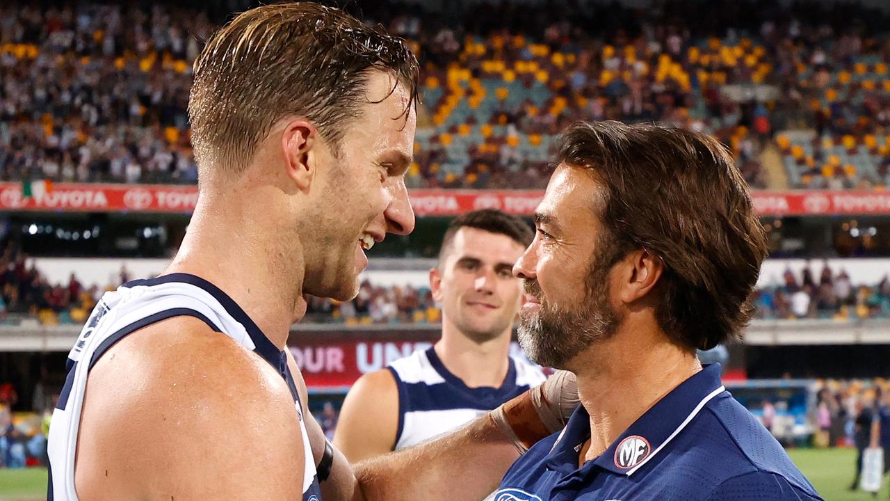 Lachie Henderson and Geelong coach Chris Scott celebrate winning the 2020 AFL Second Preliminary Final over Brisbane at The Gabba in October 2020. Picture: Getty Images