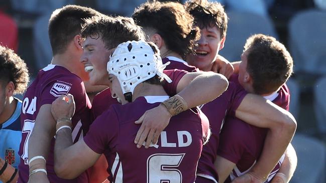 QLD celebrate after their win in the under 18 ASSRL schoolboy rugby league championship grand final - Jye Gray (TSS, head gear), hugs Marsden SHS’s Coby Black, while Liam Le Blanc (right) hugs PBC SHS’s Josh Lynn. All boys are NRL signed.Picture: Zak Simmonds