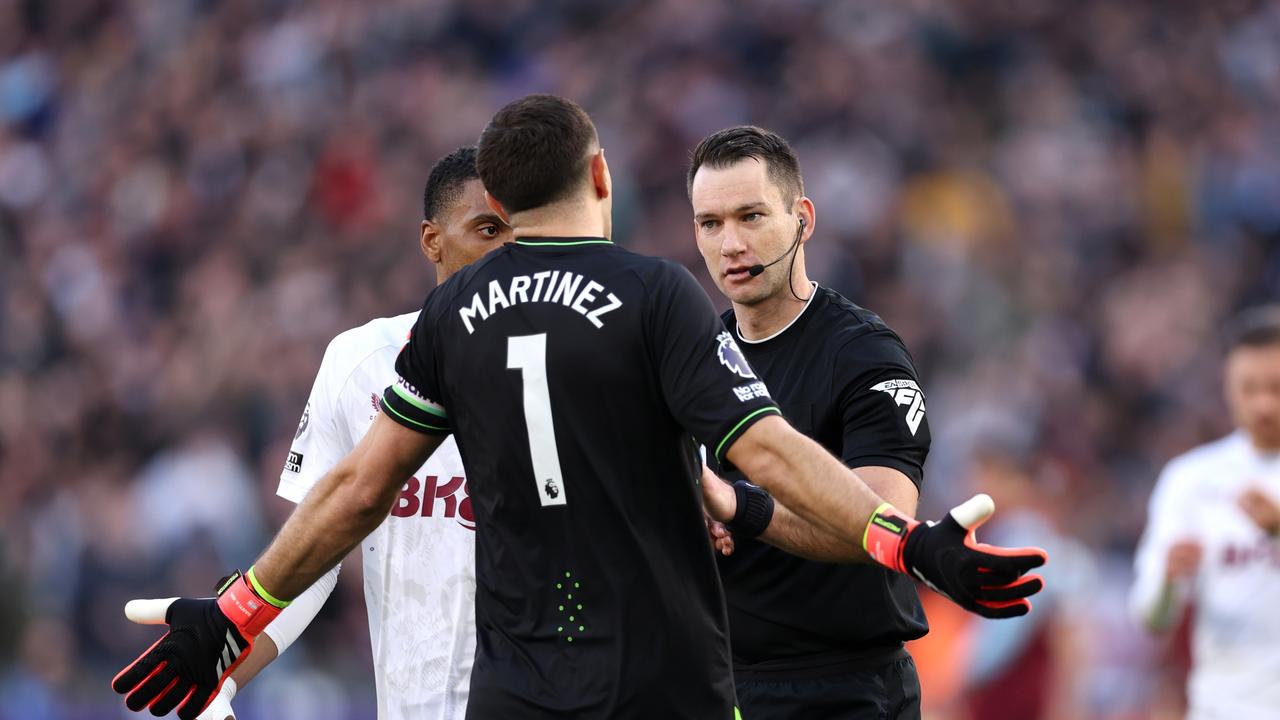 LONDON, ENGLAND – MARCH 17: Emiliano Martinez of Aston Villa speaks with Referee Jarred Gillett during the Premier League match between West Ham United and Aston Villa at London Stadium on March 17, 2024 in London, England. (Photo by Julian Finney/Getty Images)