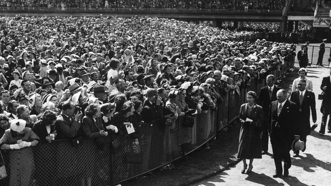 Queen Elizabeth II and Prince Philip arrive at Flemington racetrack in 1954.