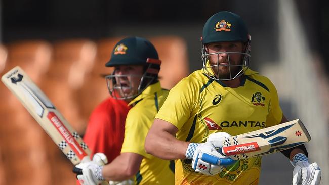 Australia's captain Aaron Finch (R) was on just nine when Head brought up his half-century. Picture: AFP