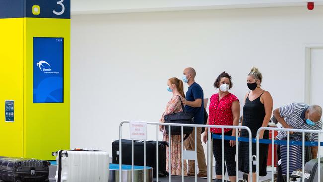 Passengers from Adelaide and Brisbane on board flight QF824 were segregated once they arrived at Darwin Airport. Picture: Che Chorley