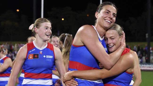 MELBOURNE, AUSTRALIA - SEPTEMBER 27: Alice Edmonds of the Bulldogs and Heidi Woodley of the Bulldogs celebrate after the final siren during the round five AFLW match between Western Bulldogs and Sydney Swans at Mission Whitten Oval, on September 27, 2024, in Melbourne, Australia. (Photo by Martin Keep/AFL Photos/via Getty Images)