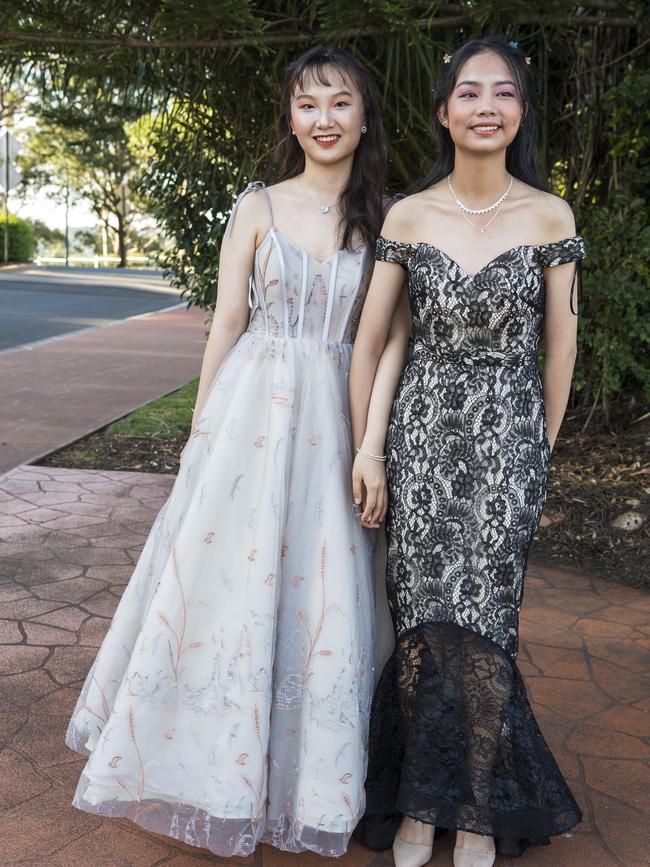 Catherine Tao (left) and Sophie Tang at Centenary Heights State High School formal at Picnic Point, Friday, November 20, 2020. Picture: Kevin Farmer