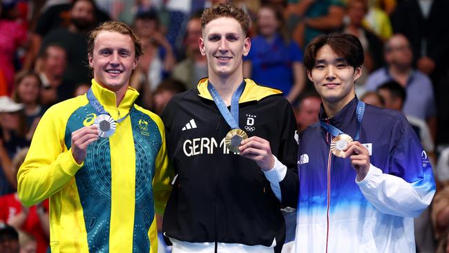 Elijah Winnington celebrates his silver with gold medalist, Lukas Martens and Woomin Kim from South Korea. Picture: Maddie Meyer/Getty Images