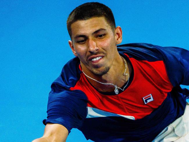 Australia's Alexei Popyrin hits a return against Russia's Roman Safiullin during their men's singles match at the Brisbane International tennis tournament in Brisbane on January 3, 2024. (Photo by Patrick HAMILTON / AFP) / --IMAGE RESTRICTED TO EDITORIAL USE - STRICTLY NO COMMERCIAL USE--