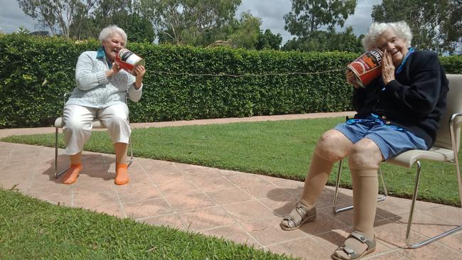 FUN: Regis Maroochydore residents Norma Rogers and Rita Williams, enjoying the sunshine and reminiscing, while still keeping in mind social distancing.