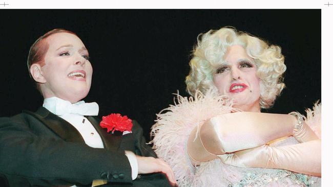 Then mayor Rudy Giuliani, right, dressed in drag, sings with Julie Andrews at the New York Hilton, during a media dinner presented by the Inner Circle. Picture: AP