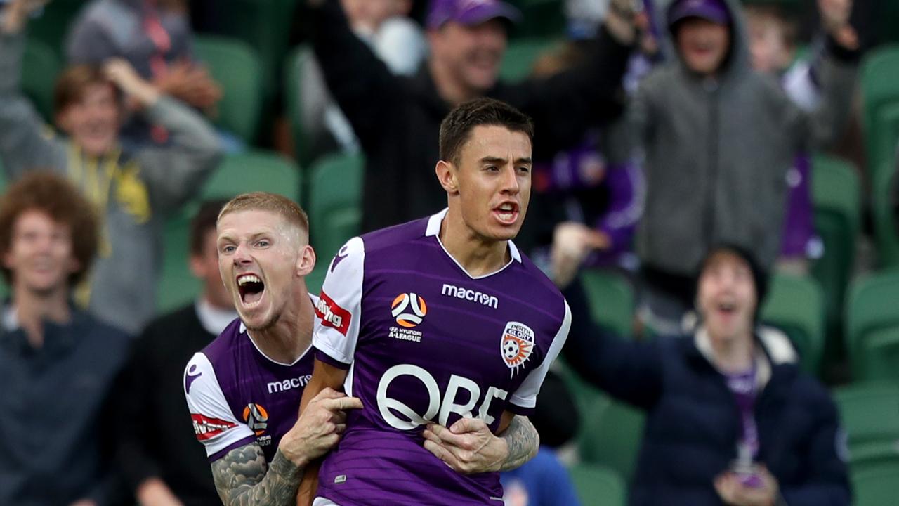 Christopher Ikonomidis (right) of the Glory is congratulated by Andy Keogh after scoring a goal